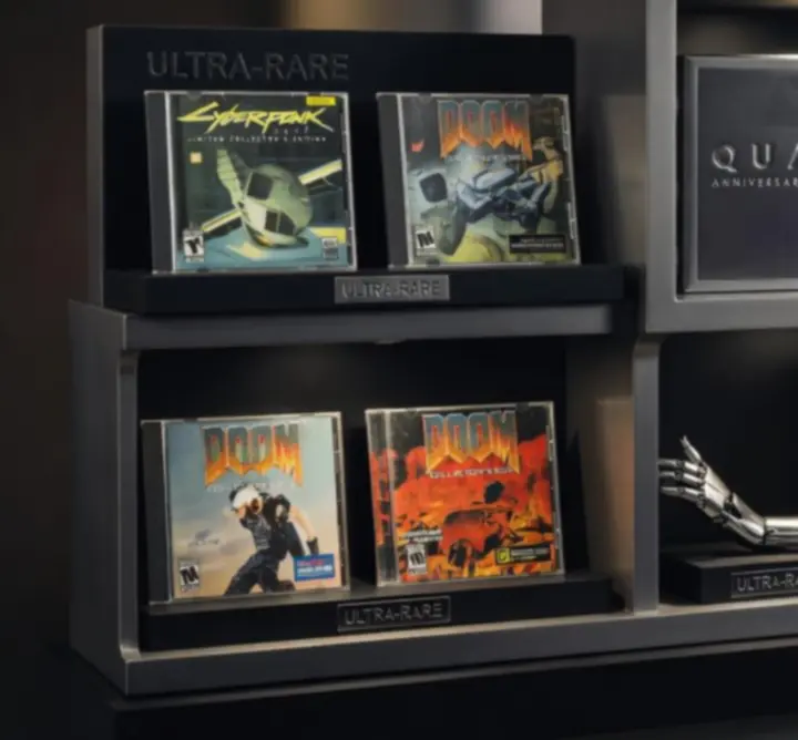 Vitrine de jeux PC ultra-rares et éditions limitées mises en scène sous une lumière cinématique